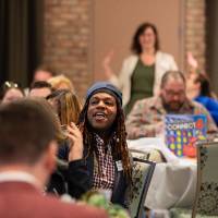 people celebrating at luncheon tables